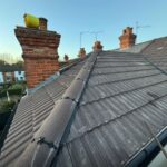 Lead flashing and roof tile repair by roofing company in Weybridge