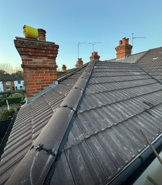 Lead flashing and roof tile repair by roofing company in Weybridge