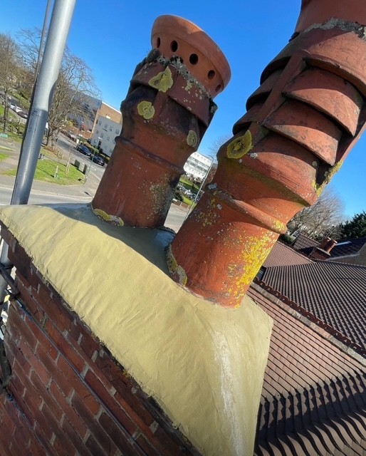 Clay chimney pots installation by roofing company