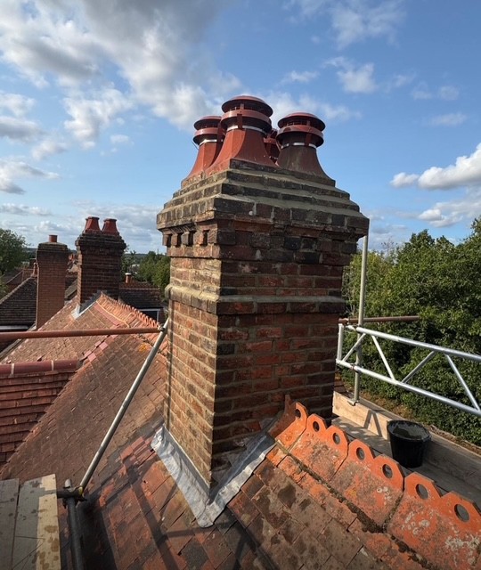 Chimney repair and roof maintenance by roofing company in Weybridge